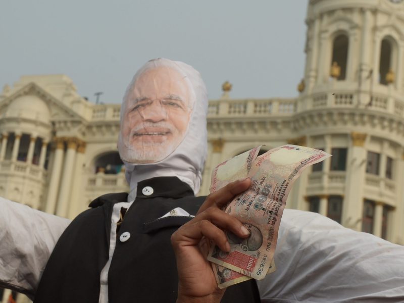 Protesters in Kolkata make their views about India's demonetization known. Photo: AFP / Dibyangshu SARKAR